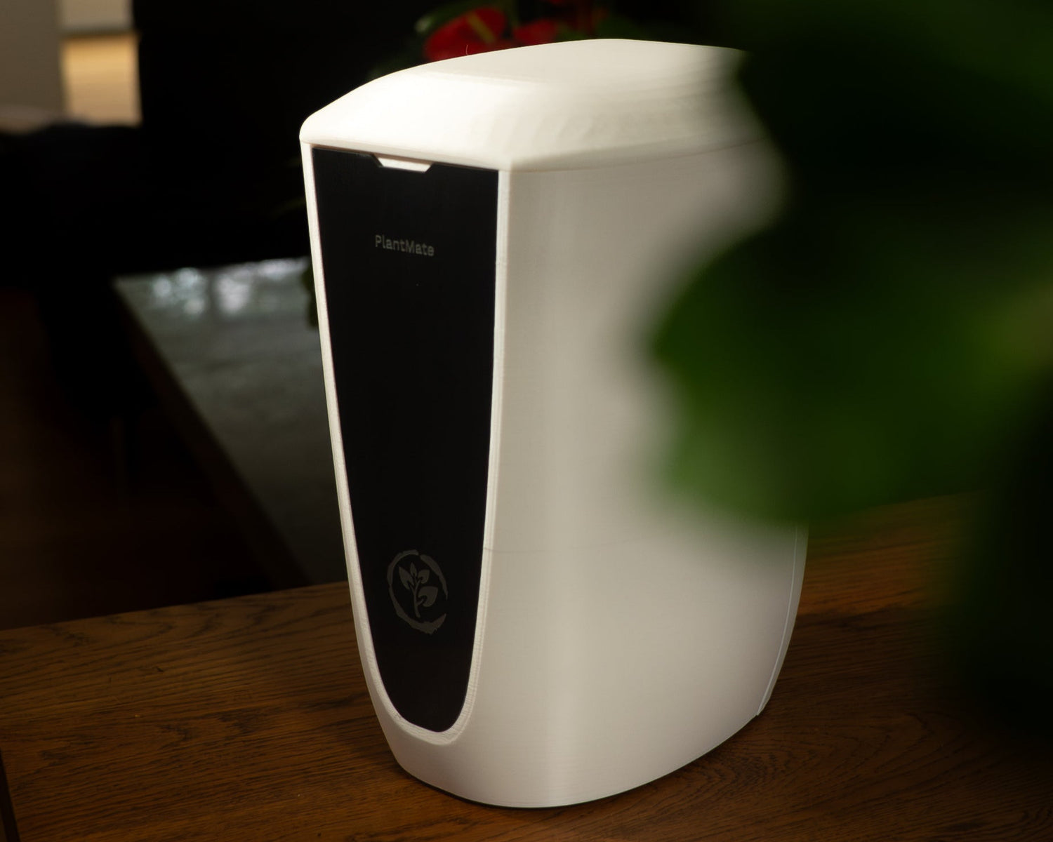 PlantMate automatic plant watering device in home setting eliminating stress of plant care watering schedules