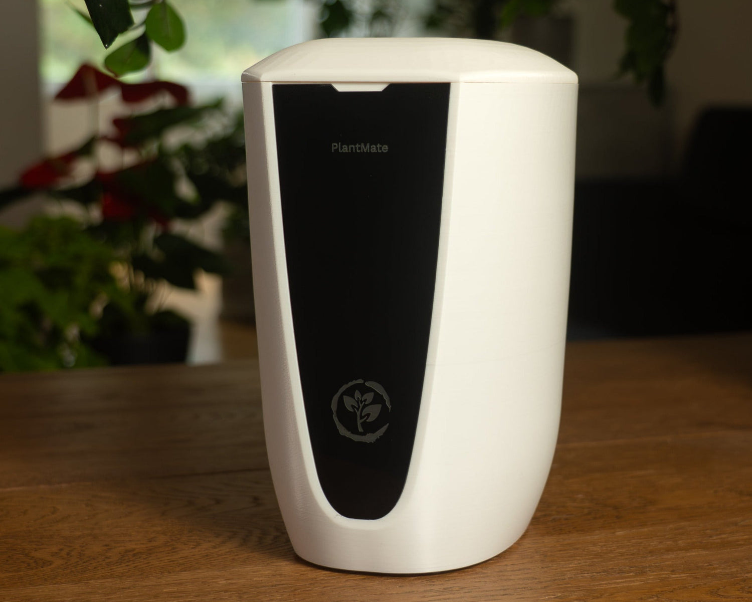 PlantMate automatic plant watering system with white body, black display panel, and 5-liter water tank for smart plant care