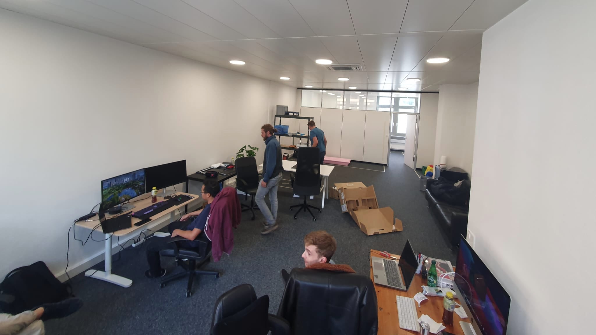PlantMate development team working in modern Swiss office creating automatic plant care automation technology