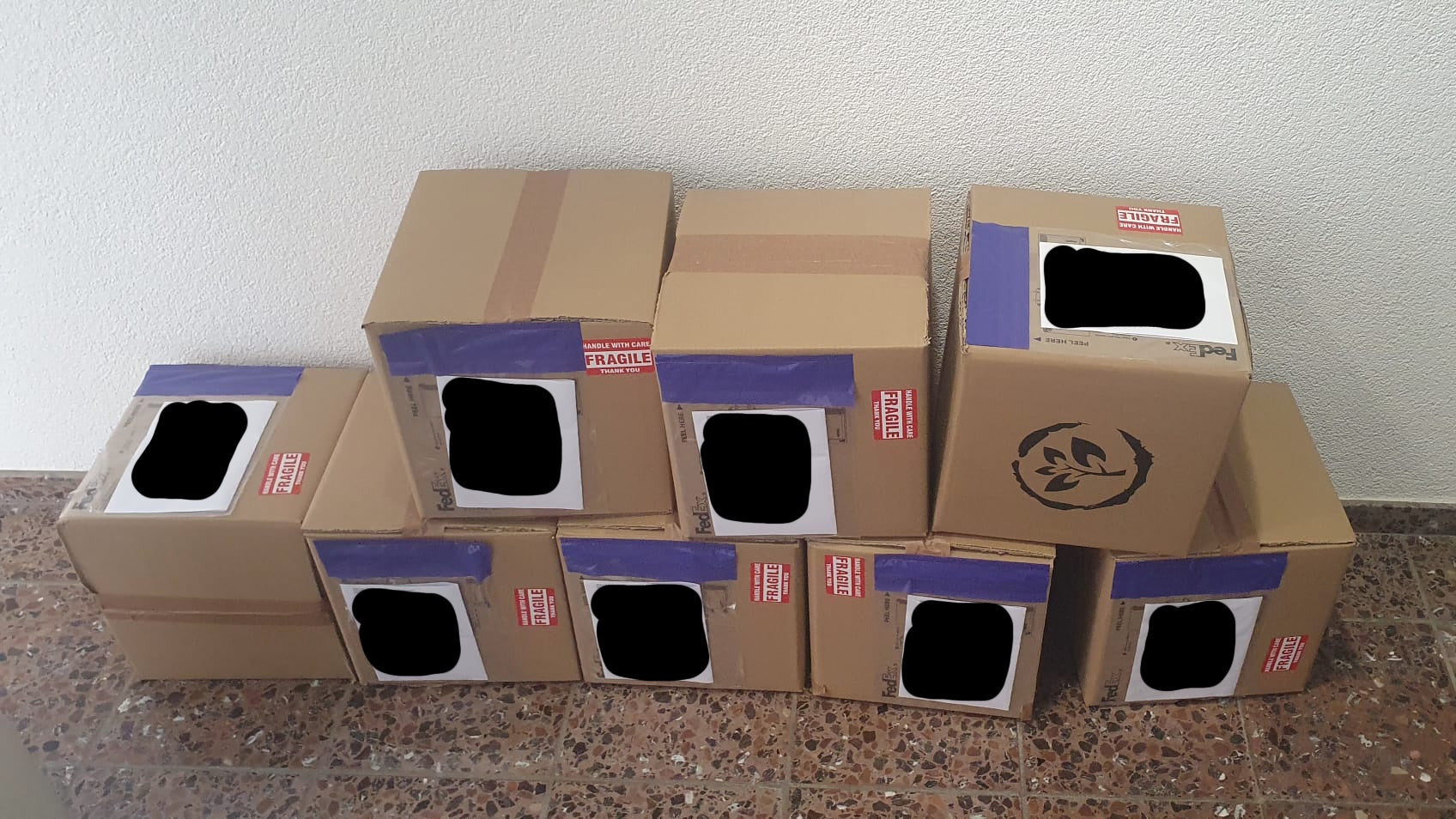 PlantMate products in branded packaging boxes with viewing windows, prepared for shipping by Plantup logistics team
